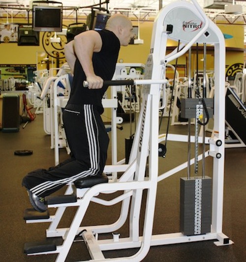 THE WEIGHT-ASSISTED DIP MACHINE BUILDS THE UPPER ARMS (FOCUSING ON THE TRICEPS), PLUS THE CHEST AND SHOULDERS. ADJUST THE RESISTANCE UPWARD EVERY WEEK TO A WEIGHT YOU CAN HANDLE WITH GOOD FORM FOR AT LEAST 12 REPS. REGULAR USE OF THE MACHINE BUILDS THE ENTIRE UPPER BODY. - BY WINA STURGEON