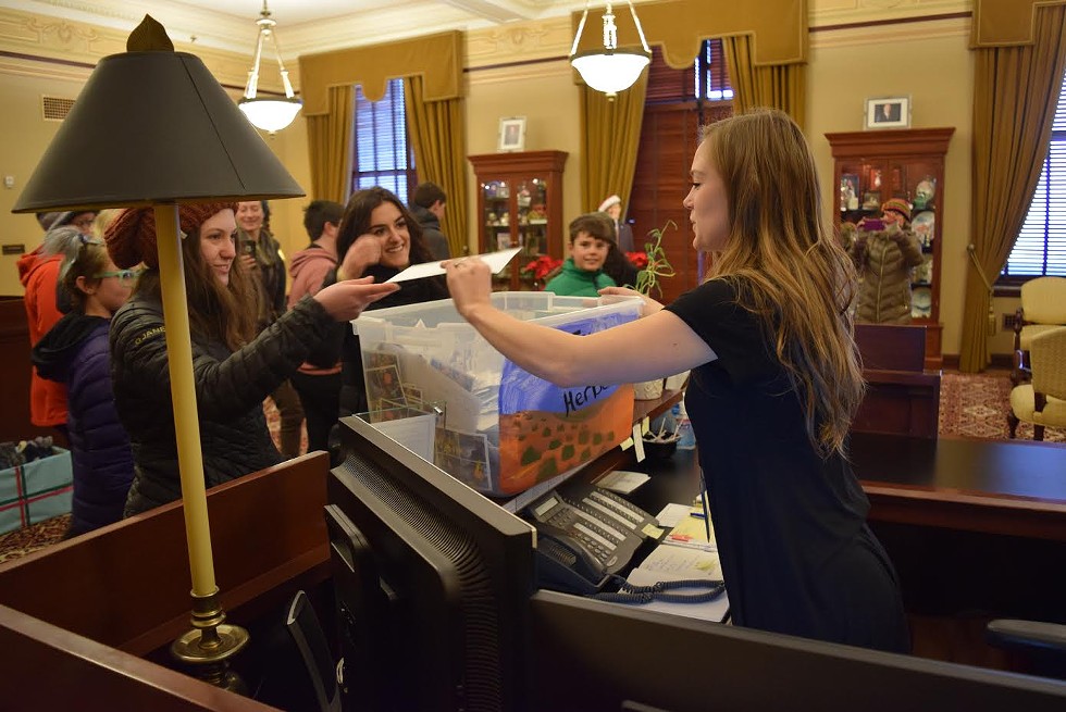 Students drop off the letter bounty in support of public lands to Gov. Gary Herbert's office. - RAY HOWZE