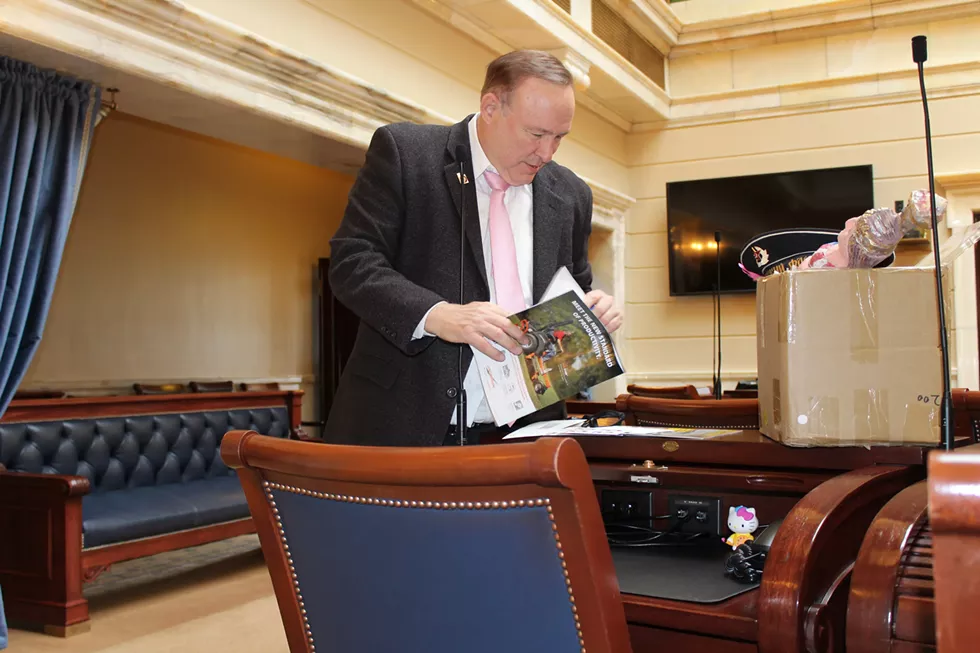 Dabakis ceremoniously cleans out his desk during an April photo shoot with City Weekly. - ENRIQUE LIMÓN