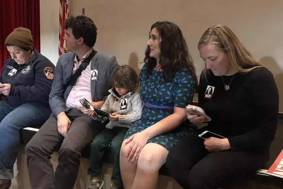 Accompanied by her husband Nicholas Steffens and son Desmond, Ghorbani awaits her fate during a recent meeting of the Salt Lake County Democratic Central Committee. - KELAN LYONS