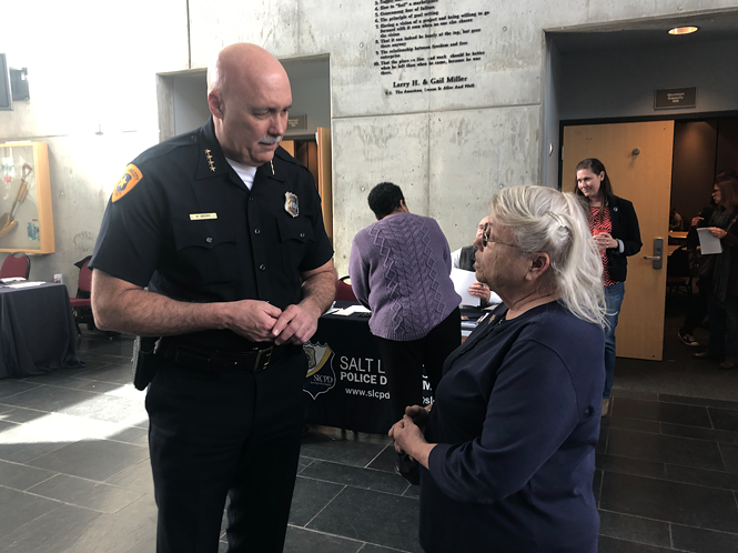 Linda Fields and Police Chief Mike Brown talk at the inaugural Missing in Utah open house. - KELAN LYONS