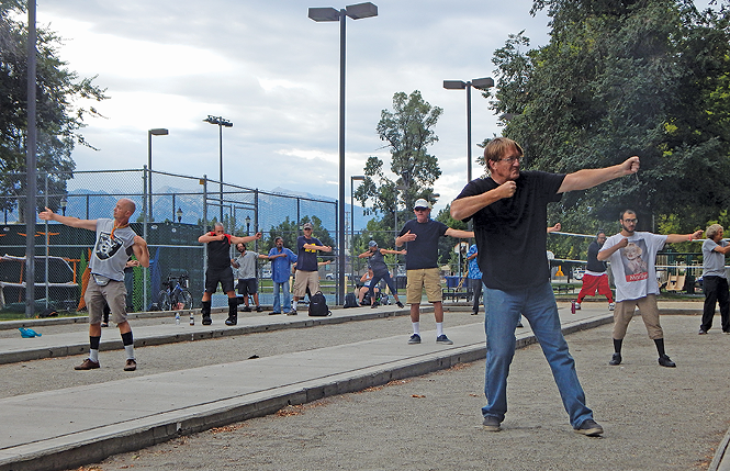 Tai Chi with the homeless at Pioneer Park. - PETER HOLSLIN