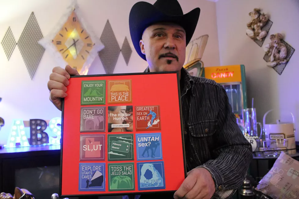 Taking a break from the frenzy inside his Millcreek home, Sanders holds a framed collection of the controversial condoms arranged in the shape of the state of Utah. - ENRIQUE LIMÓN