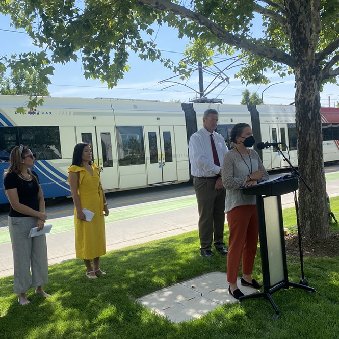 (L-R)  City Councilperson Ana Valdemoros, artist Jiyoun Lee-Lodge and UTA Chairman Carlton Christensen look on as Salt Lake City Erin Mendenhall speaks to the press at the opening of a new TRAX transit station at 650 S. Main St on Tuesday, July 26, 2022. - BENJAMIN WOOD