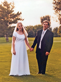 Kerry Clift Spencer, left, in 2000, posing for a wedding photo with her now ex-husband. - COURTESY PHOTO