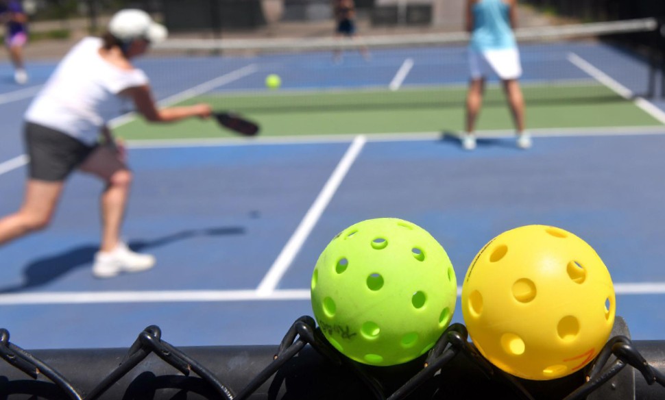 The tools of the pickleball trade: the wiffle ball and the paddle (don't dare call it a racket!) - DEREK CARLISLE