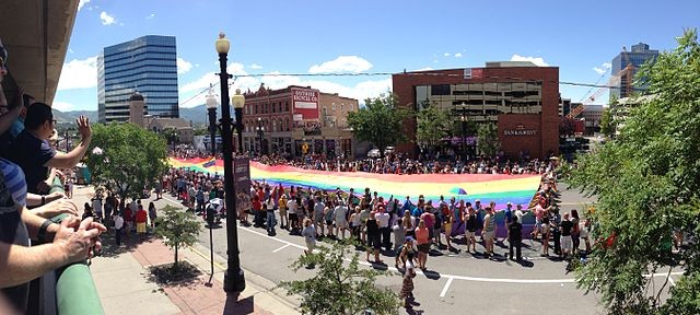 A rainbow flag is carried along 200 South during the Utah Pride Parade. - WIKIMEDIA COMMONS
