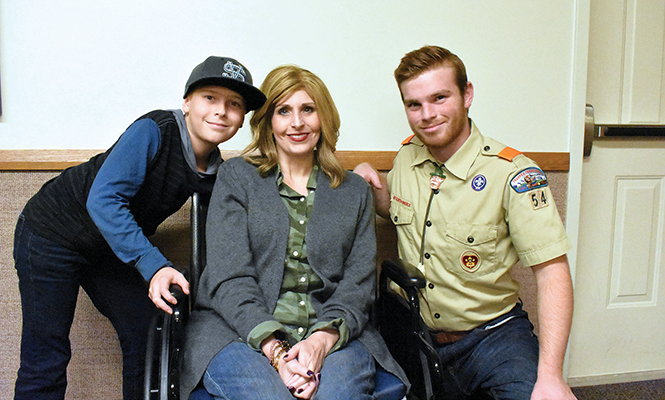 Author Brock Marchant, right, in his teen years, with his mother and brother at a scouting event. - COURTESY PHOTO