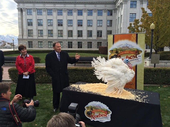 Utah commissioner of agriculture LuAnn Adams looks on as Gov. Gary Herbert pardons Norbert the turkey. - COLBY FRAZIER