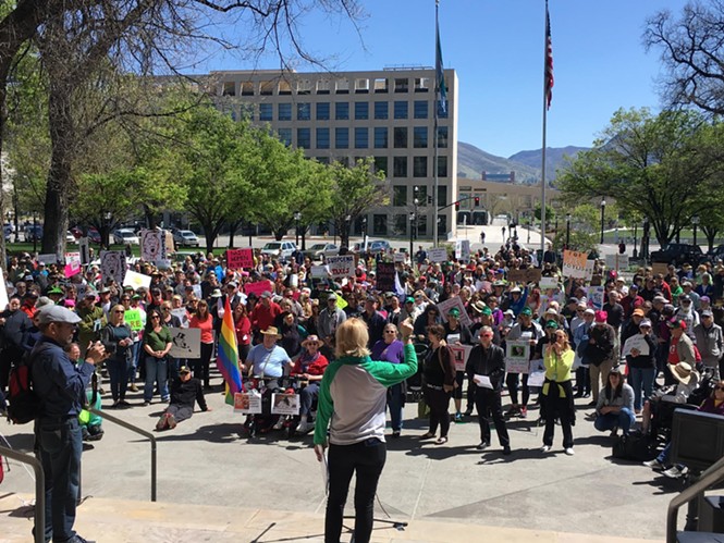 Stacy Hughes, coordinator for the Utah Trump Tax March, addresses the crowd. - DW HARRIS