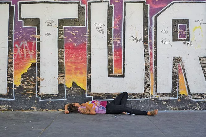 Scenes like the above are commonplace around the downtown shelter’s perimeter. - STEVEN VARGO/FILE