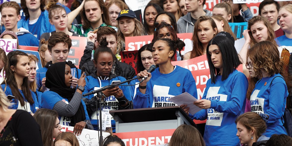 Student organizer Abena Bakenra addresses the March for Our Lives mass. - SARAH ARNOFF