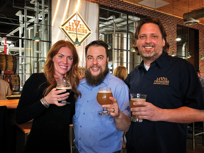 The Level Crossing Brewing Co. braintrust: Business development manager Katie Flanagan, left, head brewer Chris Detrick, middle, and owner Mark Medura - MIKE RIEDEL
