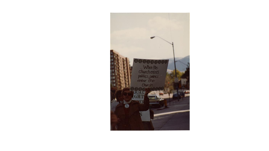Demonstrators carrying pro-ERA signs march down SLC streets on Oct. 2 1982, during The Church of Jesus Christ of Latter-day Saints' General Conference. - NATIONAL ORGANIZATION FOR WOMEN PHOTOGRAPHY COLLECTION