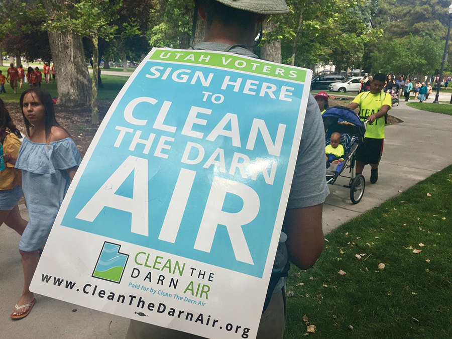 Armed with his signature sandwich board, Yoram Bauman attempts to gather signatures at Liberty Park, following this year’s Days of ’47 Parade. - ENRIQUE LIMÓN