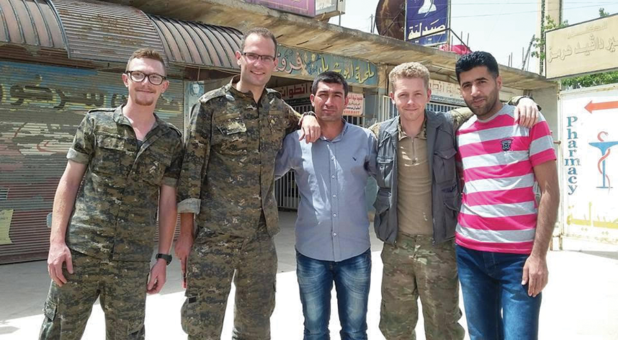 Porter Goodman, second from right, believes the new form of democracy being implemented by the Kurds is the “democratic confederalist revolution." - COURTESY PHOTO