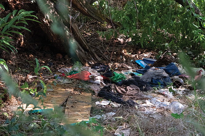 Human impacts: Garbage and litter next to an illegal camp on the Jordan River - JORDAN ALLRED