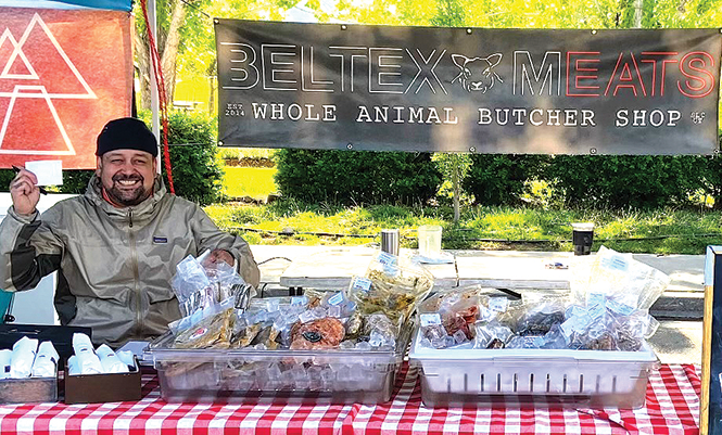 Marin Aguinaga with Beltex Meats - AIMEE L. COOK