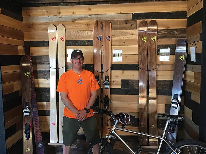 Todd Herilla with some of his custom ski models. - STEPHEN DARK