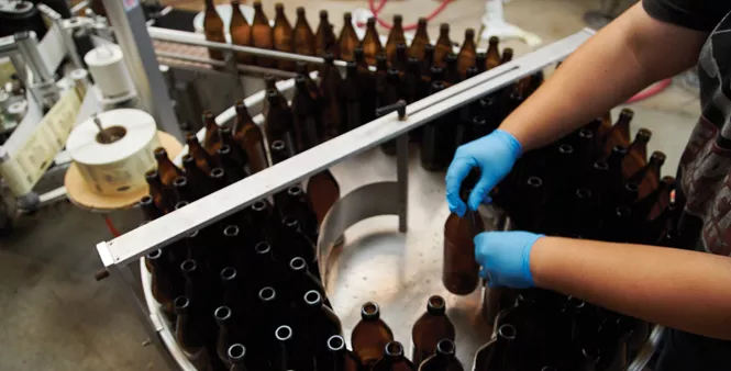 10. Adding bottles to the conveyor