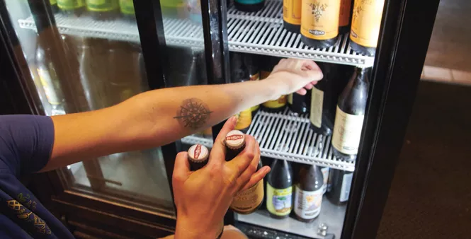 19. Lerch snags a few bottles to serve at the Downtown Red Rock Brewery location.