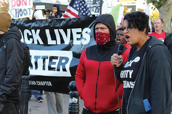 Black Lives Matter organizer Lex Scott leads supporters on a march to the City and County Building following Sunday’s protest. - ENRIQUE LIMON