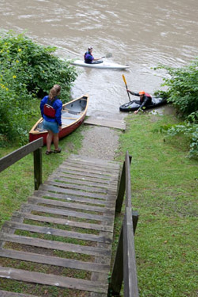 A few paddlers prepare to take out during high water.