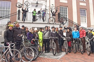 MATTHEW THORSEN - A group of cyclists in front of Burlington City Hall before a ride celebrating Budnitz Bicycles and Modern Mobility Movement Day