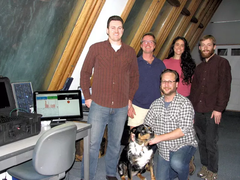 AJ Rossman (middle, blue shirt) with the staff at Smart Resource Labs - COURTESY OF SMART RESOURCE LABS