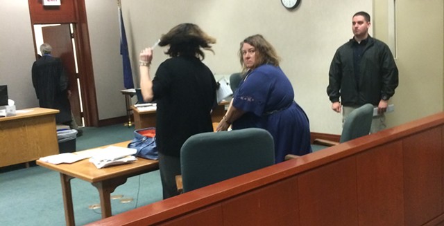 Alleged embezzler Lisa Peduzzi looks back during her arraignment in Chittenden Superior Court. - MARK DAVIS