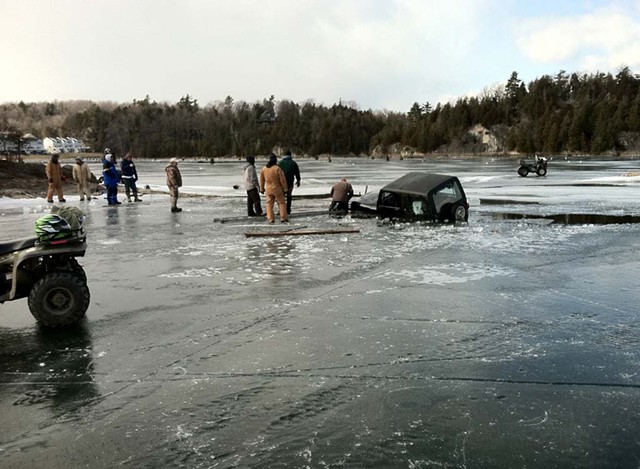 An unidentified driver attempts to pull his jeep out of the ice in Malletts Bay in February 2012 - KEN PICARD