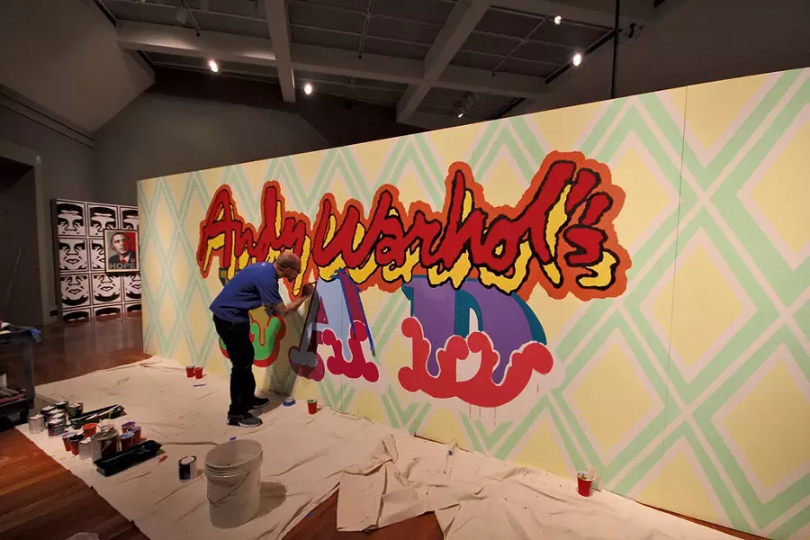 Ben Eine painting the installation "Andy Warhol's BAD" - COURTESY OF MIDDLEBURY COLLEGE