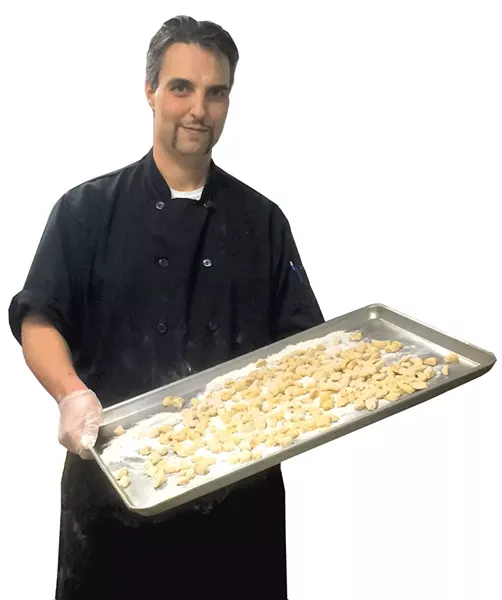 Franco Checchi with a tray of gnocchi at Junior's Rustico - ALICE LEVITT