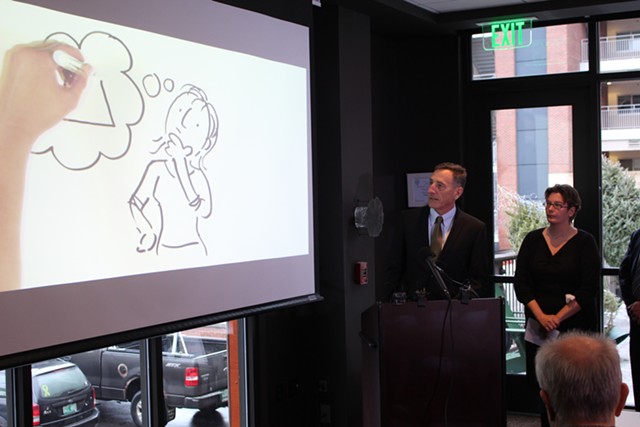 Gov. Peter Shumlin screens a new health care reform ad Wednesday at Hotel Vermont. - PAUL HEINTZ