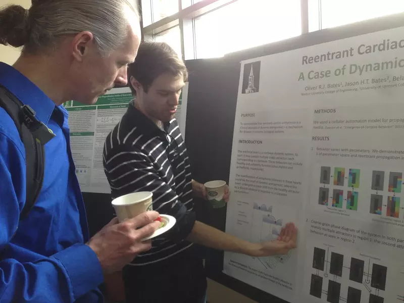 Grad student Oliver Bates explains his research to entrepreneur Uwe Heiss - COURTESY OF CATHY RESMER