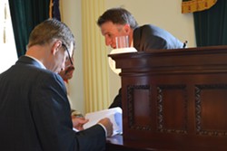 Lt. Gov. Phil Scott confers Friday with John Bloomer, Senate secretary during Senate floor action. - TERRI HALLENBECK