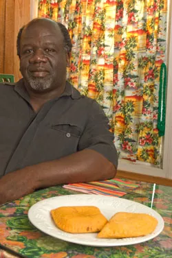 Patrick Brown with a plate of Jamaican meat patties - MATTHEW THORSEN
