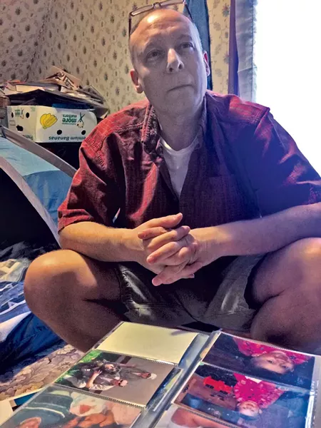 Richard Laws in an acquaintance's home, where he lives out of a tent - MARK DAVIS