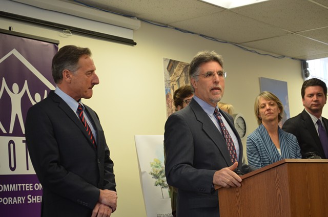 Gov. Shumlin looks on as his secretary of human services, Hal Cohen, describes the administration's new goal. - ALICIA FREESE