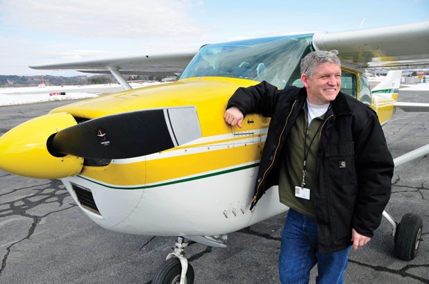 State pilot Guy Rouelle with his Cessna at Knapp Airport in Berlin - JEB WALLACE-BRODEUR