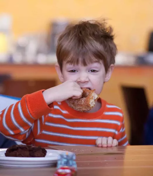 Steve Wisloski enjoys a doughnut - MATTHEW THORSEN