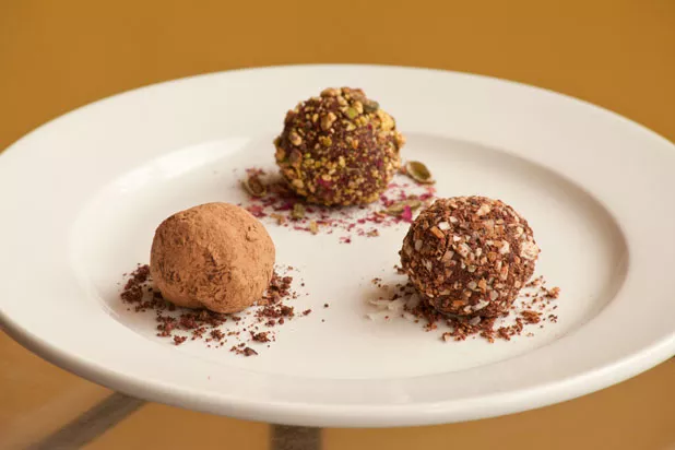 Trio of house truffles: cardamon rose pistachio, cacao nib and toasted coconut, and cocoa powder - MATTHEW THORSEN