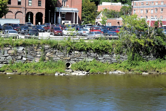 A Montpelier lot that drains directly into the Winooski River - TERRI HALLENBECK