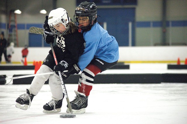 CSB U8 players fight for the puck during practice. - MATTHEW THORSEN