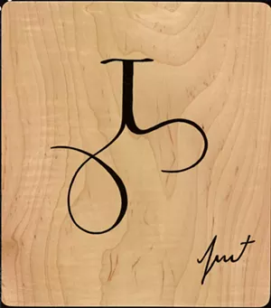 Balinese tile with letter and number - COURTESY OF TIM BROOKES
