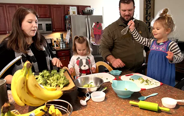 Joanna, Bree, Jake and Genevieve Scott preparing dinner together - MATTHEW THORSEN