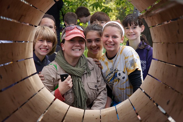 Former Milton teacher Joanna Scott poses for a photo with students in her Healthy Living class at MR Harvest Farm in South Hero during a field trip in October 2013. - COURTNEY LAMDIN / MILTON INDEPENDENT