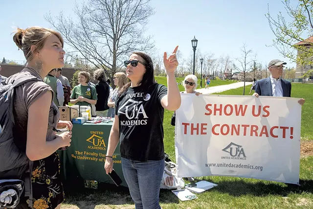 Associate professor of English Sarah Alexander (center front) speaking to passersby - JAMES BUCK