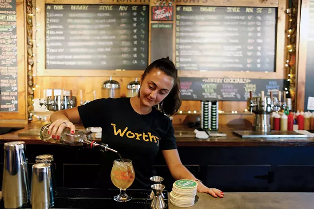 Bartender making a dark and stormy - SARAH PRIESTAP
