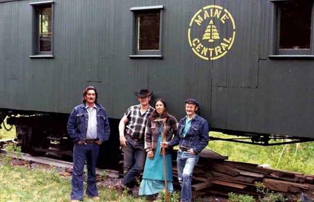Hood River Blackie; Feather River John; John's then-wife, Alice; and Hot Shot Timer in front of an old Maine Central caboose in McClaughry's yard circa 1974 - COURTESY OF JOHN MCCLAUGHRY